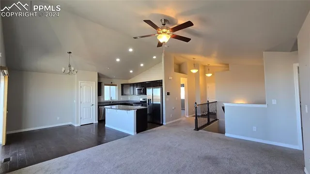a view of an empty room and a window
