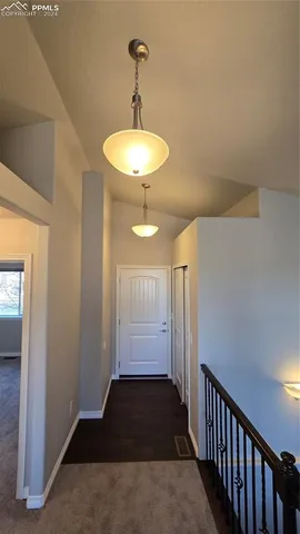 a bathroom with a granite countertop bathtub sink vanity mirror and toilet