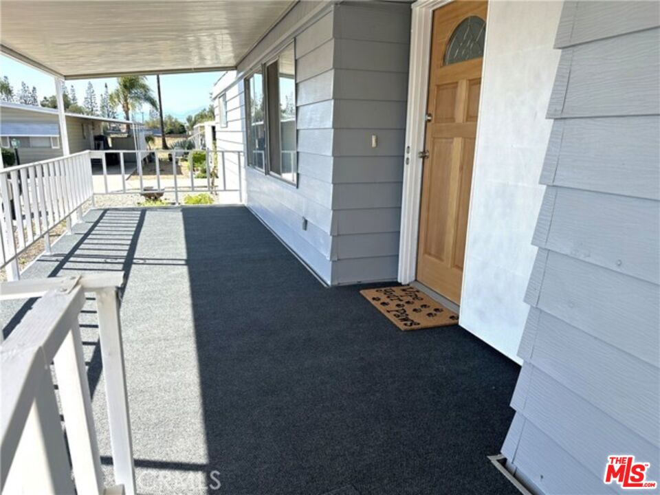 9391 California Avenue, Unit 89 Riverside, CA 92503 - Photo 15 of 16 a view of a balcony with wooden floor
