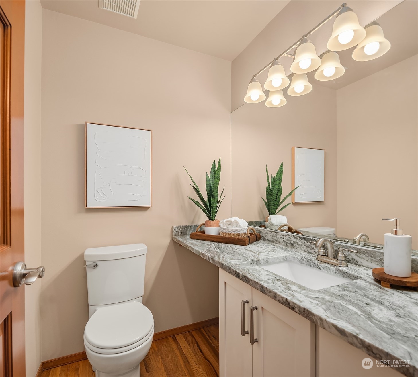 121 173rd Place Southeast Bothell, WA 98012 - Photo 23 of 39 a bathroom with a granite countertop toilet sink and mirror