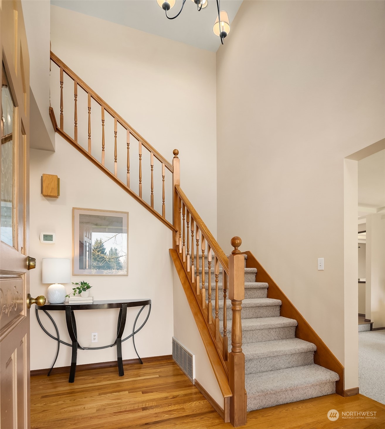 121 173rd Place Southeast Bothell, WA 98012 - Photo 3 of 39 a view of entryway and hall with wooden floor