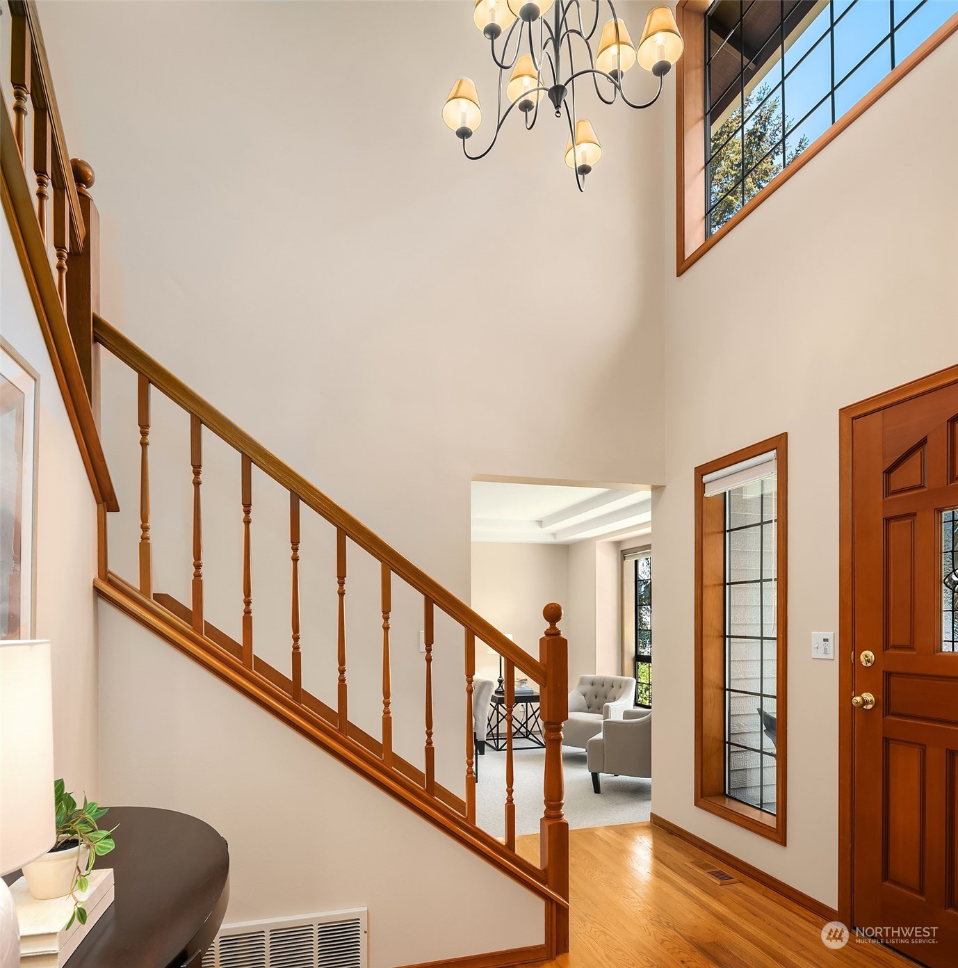 121 173rd Place Southeast Bothell, WA 98012 - Photo 4 of 39 a view of an entryway wooden floor and chandelier