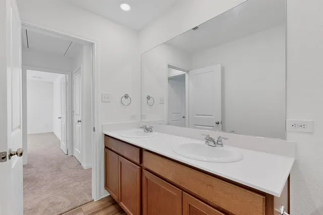 a view of walk in closet with empty racks