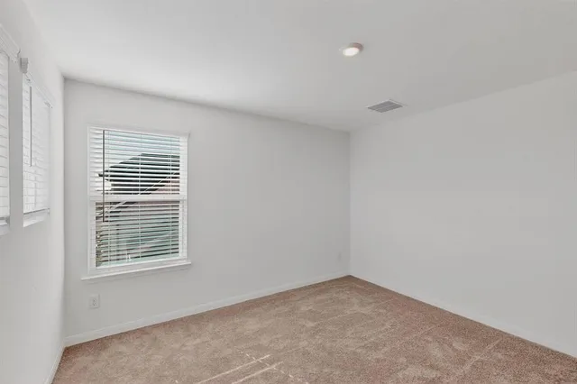 an empty room with closet area