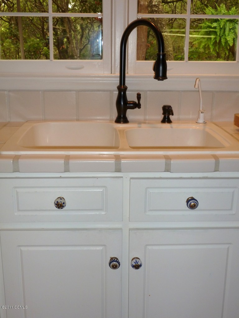 561 Coral Ridge Road Pine Knoll Shores, NC 28512 - Photo 45 of 46 Solid Surface Sink w/Upgraded Faucet
