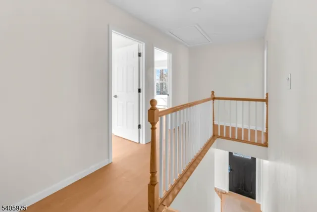 a view of a hallway with staircase