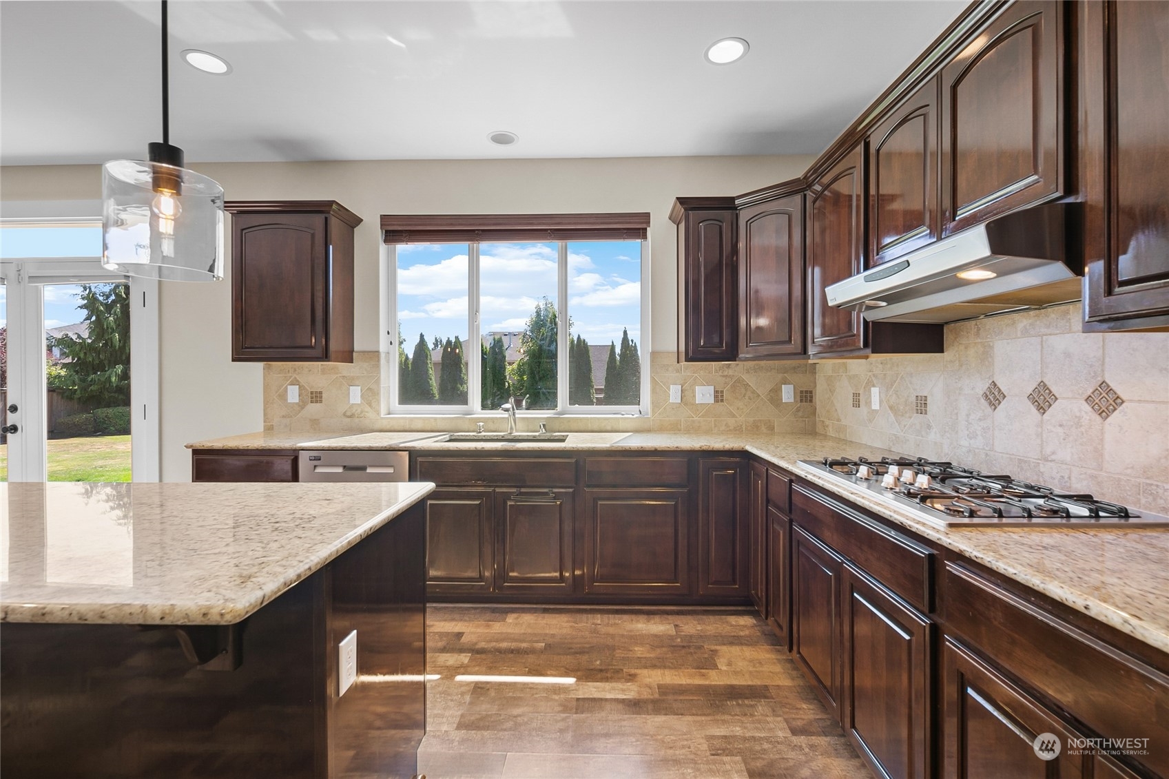 3110 216th Place Southeast Bothell, WA 98021 - Photo 17 of 37 a kitchen with stainless steel appliances granite countertop a sink stove and cabinets