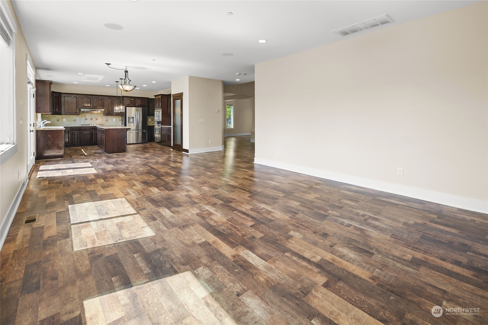3110 216th Place Southeast Bothell, WA 98021 - Photo 19 of 37 a view of livingroom with kitchen and chandelier