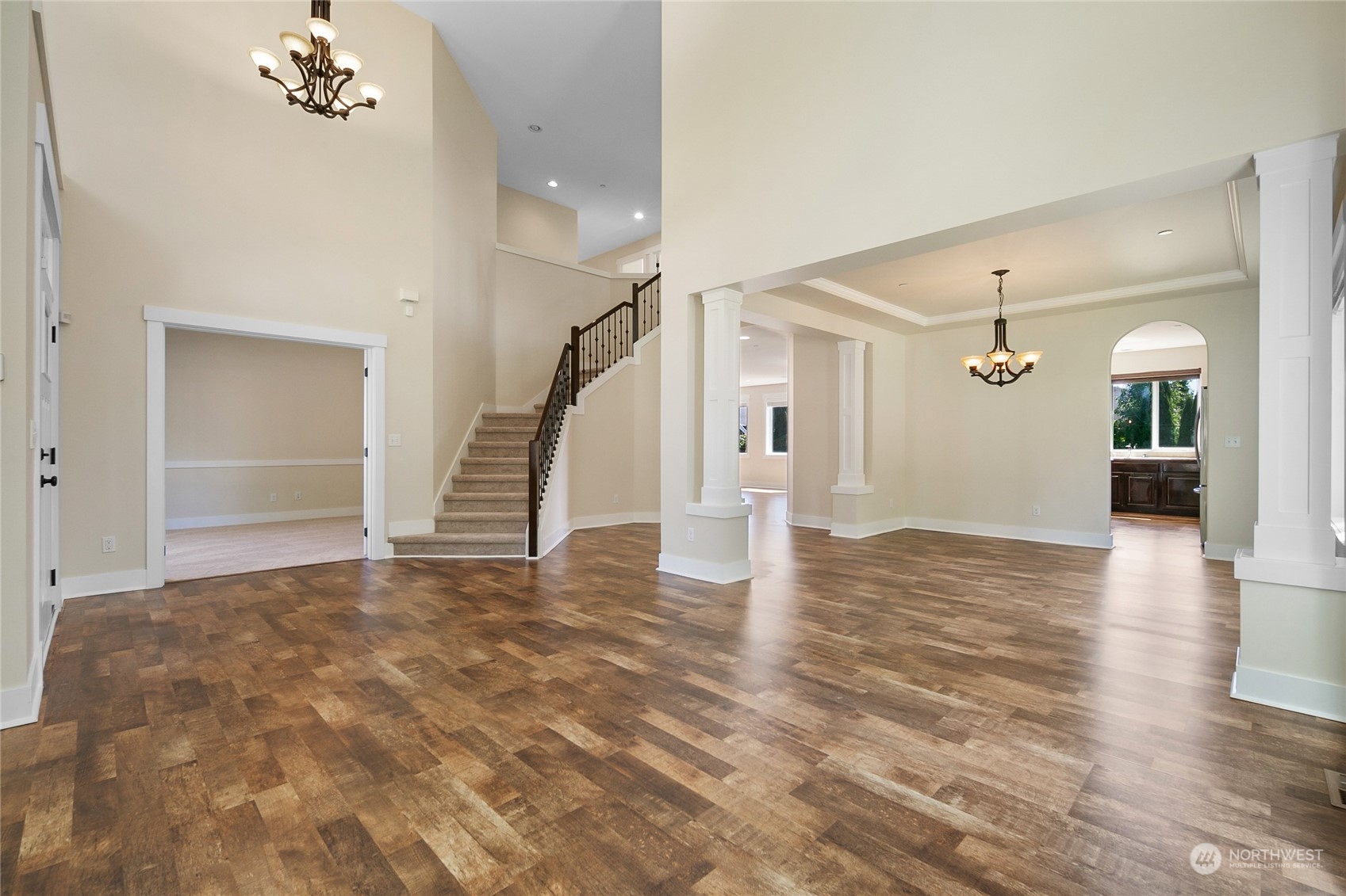 3110 216th Place Southeast Bothell, WA 98021 - Photo 22 of 37 a view of an empty room with wooden floor and a ceiling fan