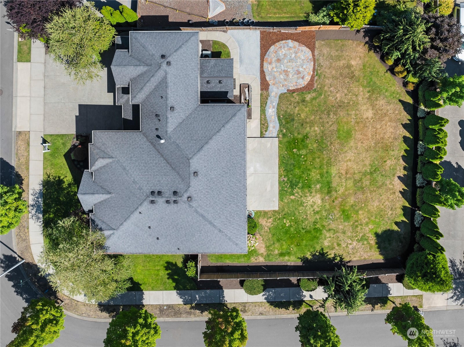 3110 216th Place Southeast Bothell, WA 98021 - Photo 3 of 37 an aerial view of a house with garden space and a swimming pool