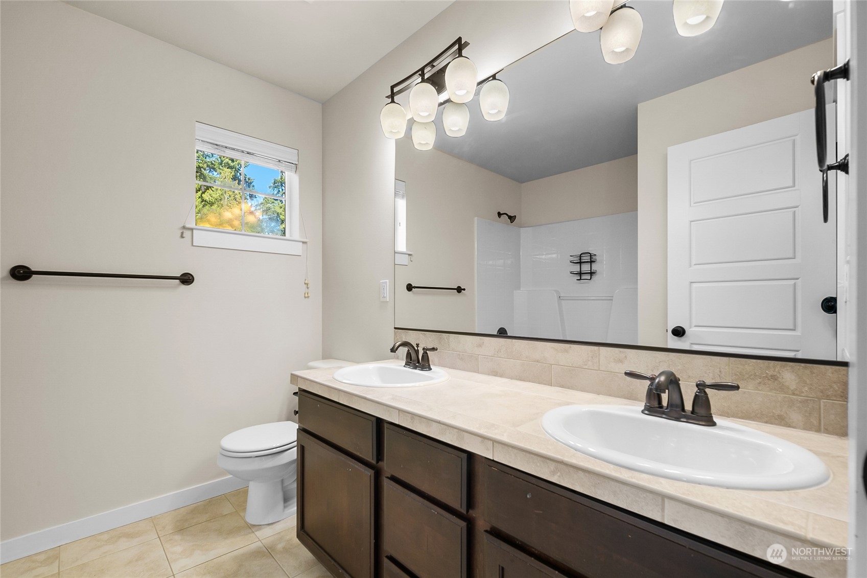 3110 216th Place Southeast Bothell, WA 98021 - Photo 32 of 37 a bathroom with a sink and a mirror