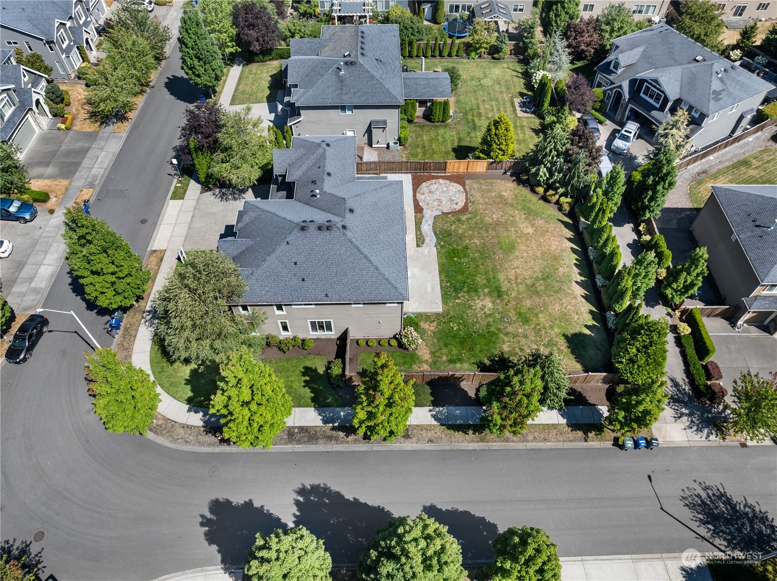 3110 216th Place Southeast Bothell, WA 98021 - Photo 6 of 37 an aerial view of a house with a yard and covered outdoor space