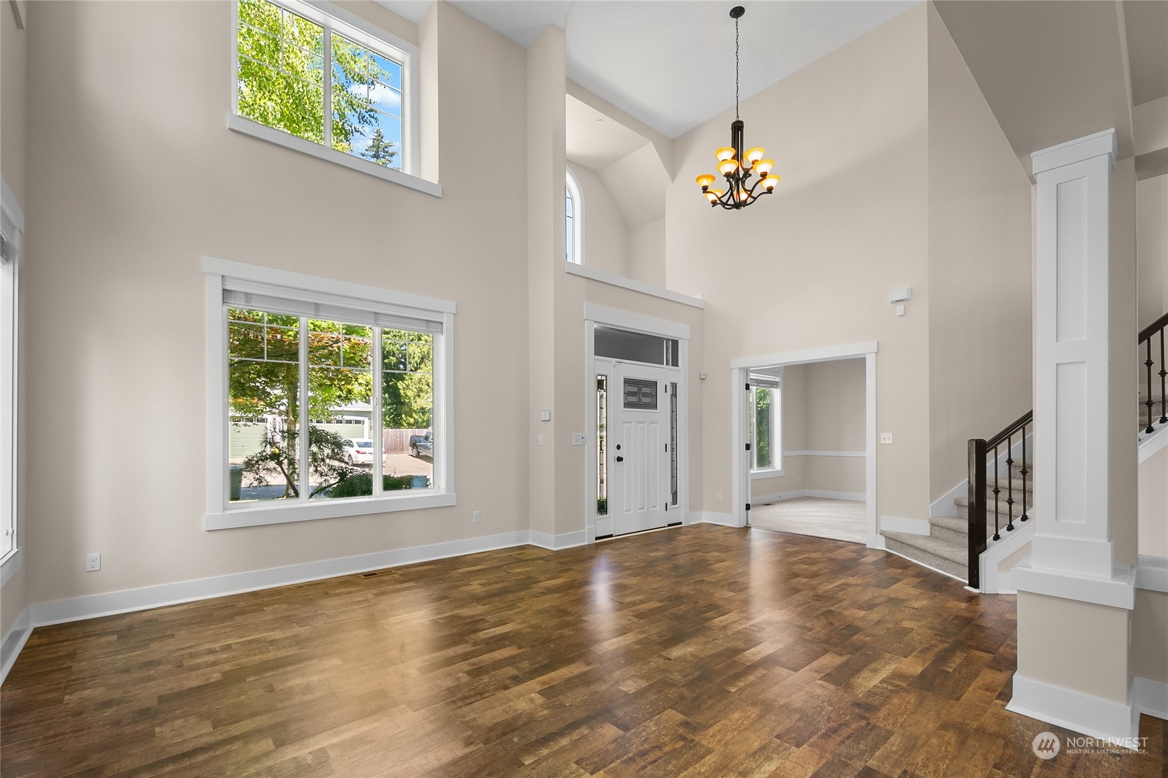 3110 216th Place Southeast Bothell, WA 98021 - Photo 8 of 37 a view of a livingroom with a window and wooden floor