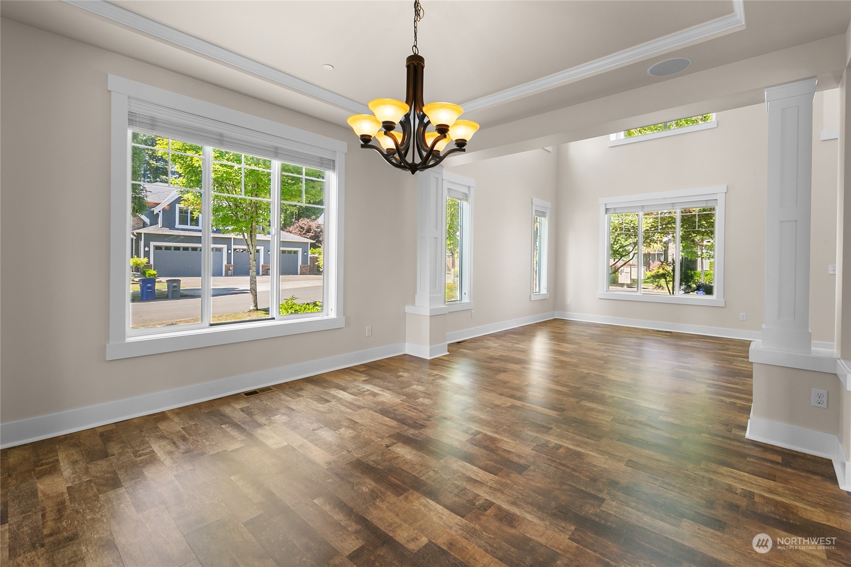 3110 216th Place Southeast Bothell, WA 98021 - Photo 10 of 37 a view of an empty room with window and chandelier fan