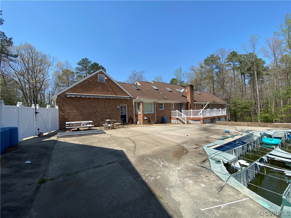 13221 Bailey Bridge Road Midlothian, VA 23112 - Photo 4 of 33 a front view of a house with a yard