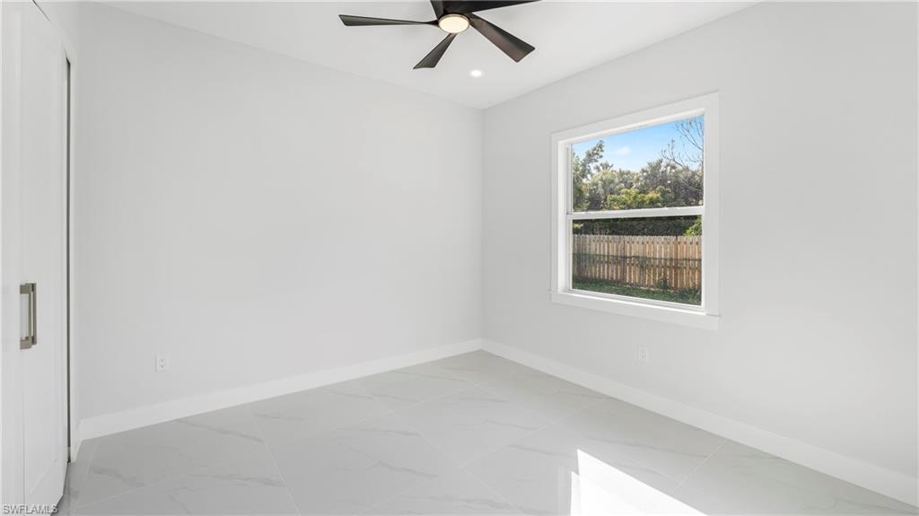 1687 19th Street Southwest Naples, FL 34117 - Photo 12 of 50 an empty room with a window