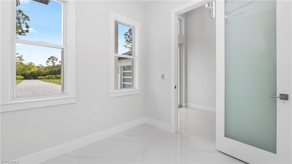 1687 19th Street Southwest Naples, FL 34117 - Photo 16 of 50 Room with windows and entrance