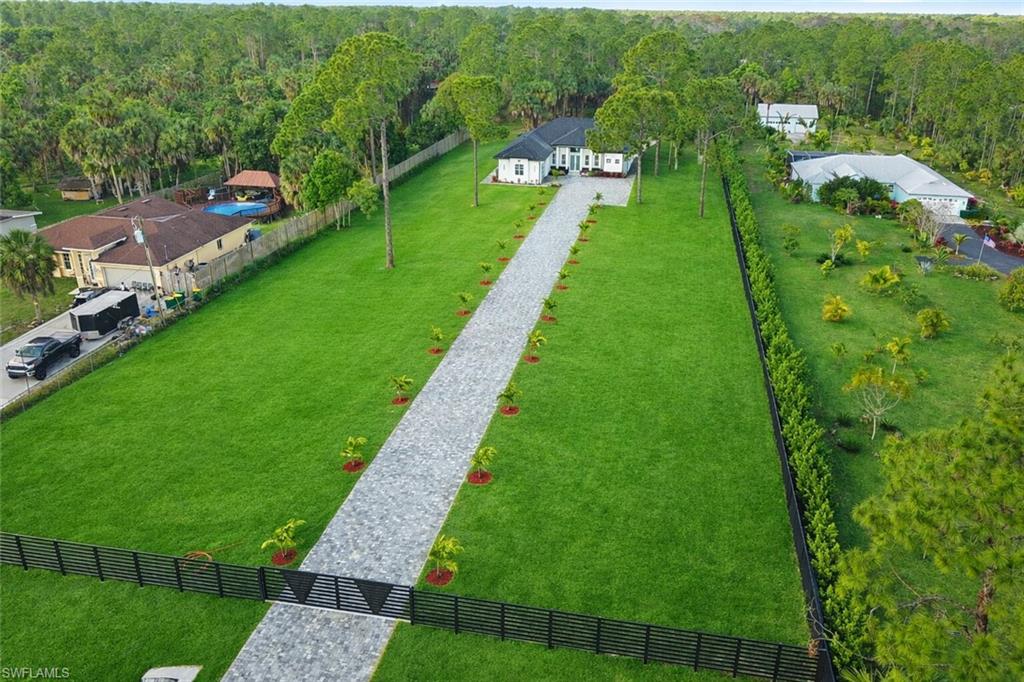 1687 19th Street Southwest Naples, FL 34117 - Photo 2 of 50 a view of a garden with houses