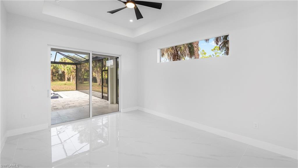 1687 19th Street Southwest Naples, FL 34117 - Photo 21 of 50 a view of a livingroom with a ceiling fan and window