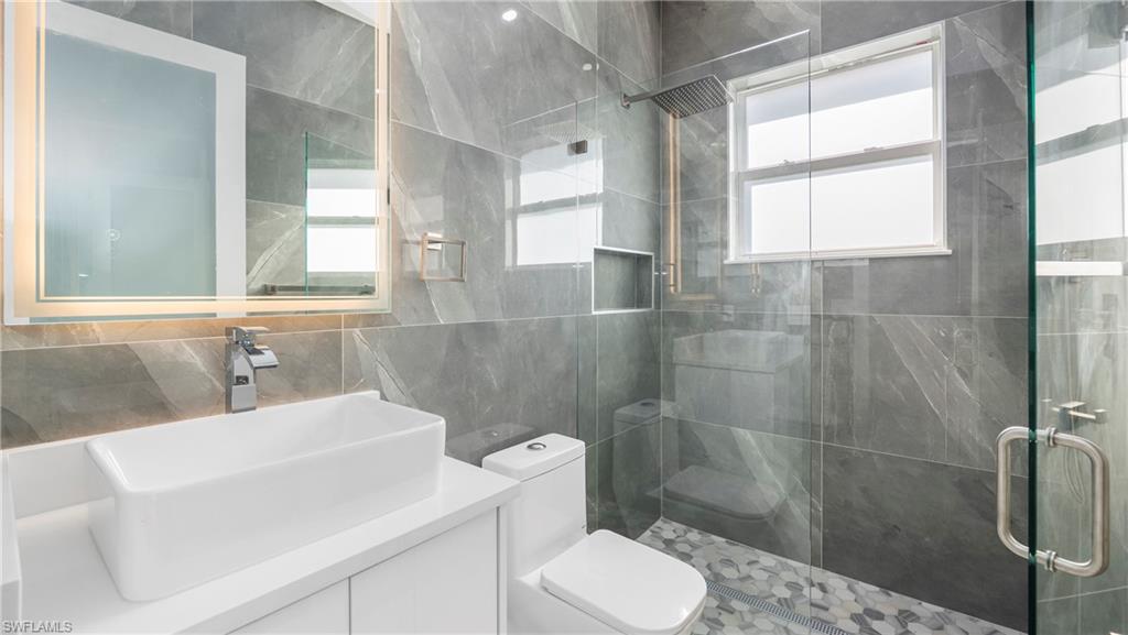 1687 19th Street Southwest Naples, FL 34117 - Photo 22 of 50 a bathroom with a sink toilet and shower