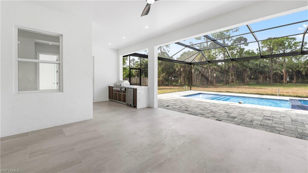 1687 19th Street Southwest Naples, FL 34117 - Photo 31 of 50 Prairie-style home with stucco siding and decorative driveway