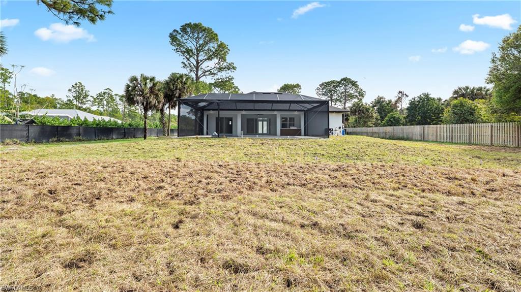 1687 19th Street Southwest Naples, FL 34117 - Photo 39 of 50 View of patio / terrace with area for grilling, a lanai, and a sunroom