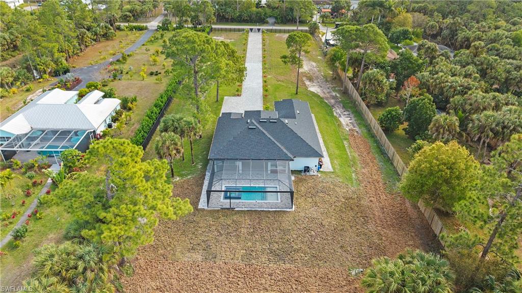 1687 19th Street Southwest Naples, FL 34117 - Photo 42 of 50 a aerial view of a house with a yard and large tree