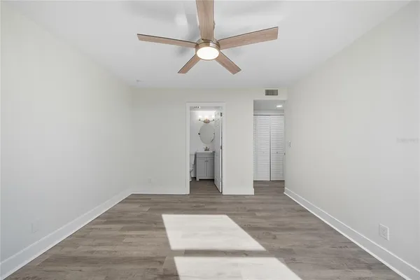 a large kitchen with stainless steel appliances granite countertop a stove a sink and a refrigerator