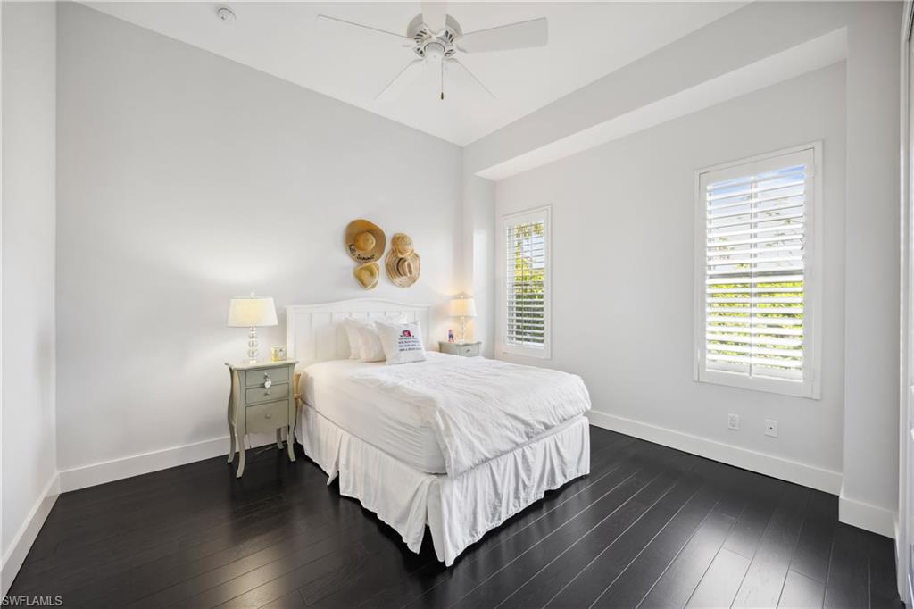 299 Mermaids Bight Naples, FL 34103 - Photo 18 of 28 a bedroom with a bed and a window