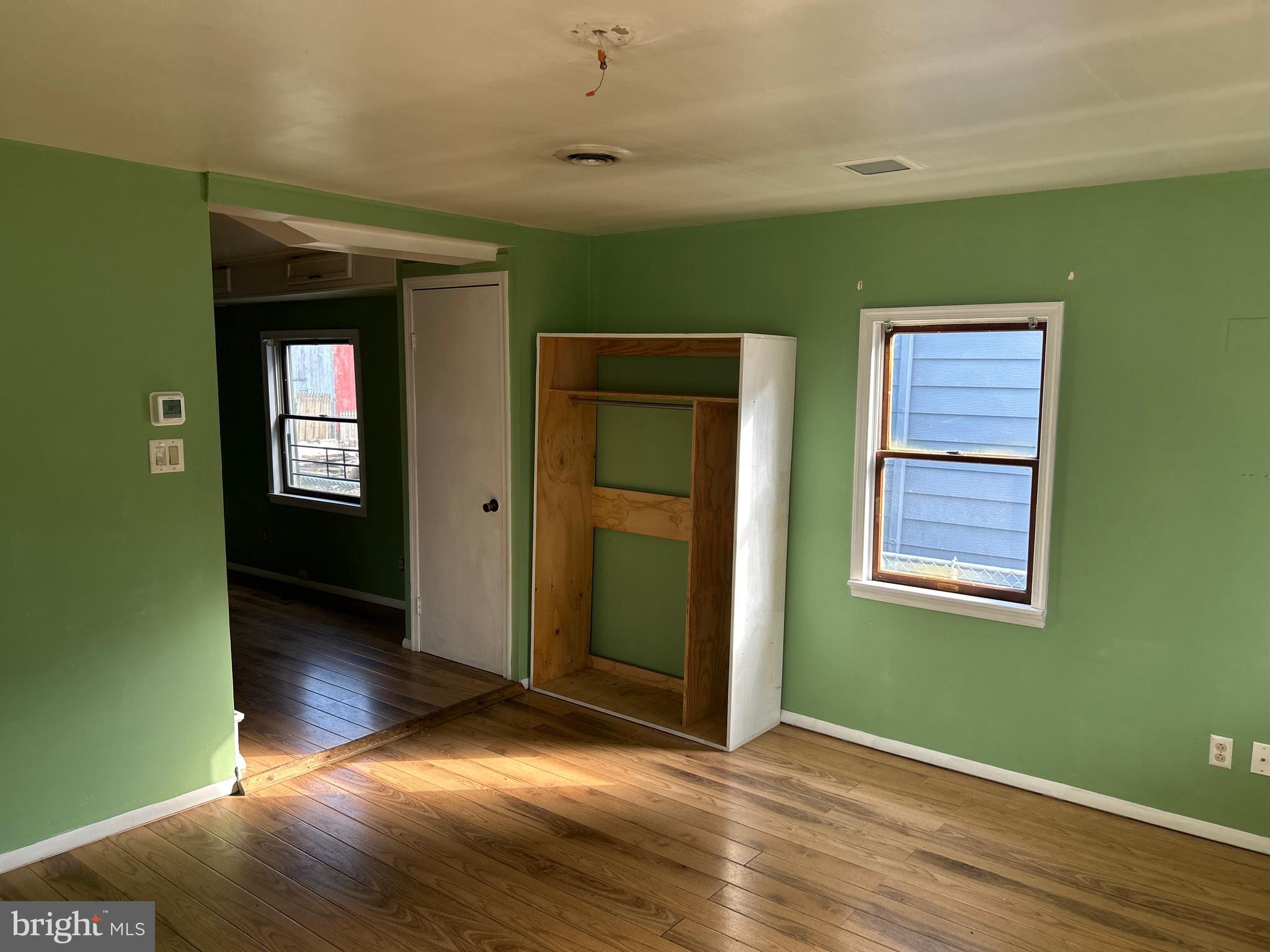 46 Penn Street Penns Grove, NJ 08069 - Photo 14 of 18 a view of an empty room with wooden floor and a window