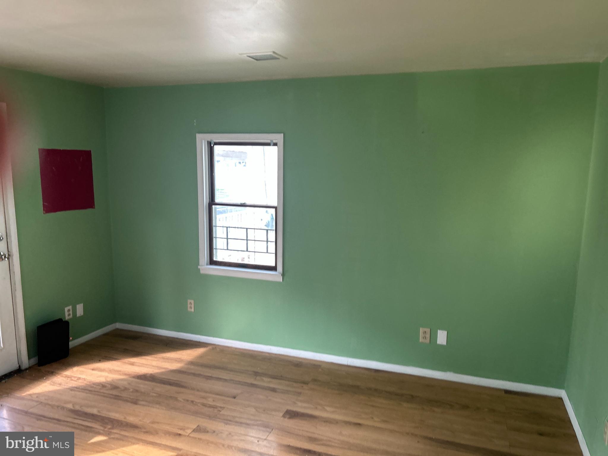 46 Penn Street Penns Grove, NJ 08069 - Photo 15 of 18 a view of a room with wooden floor and windows