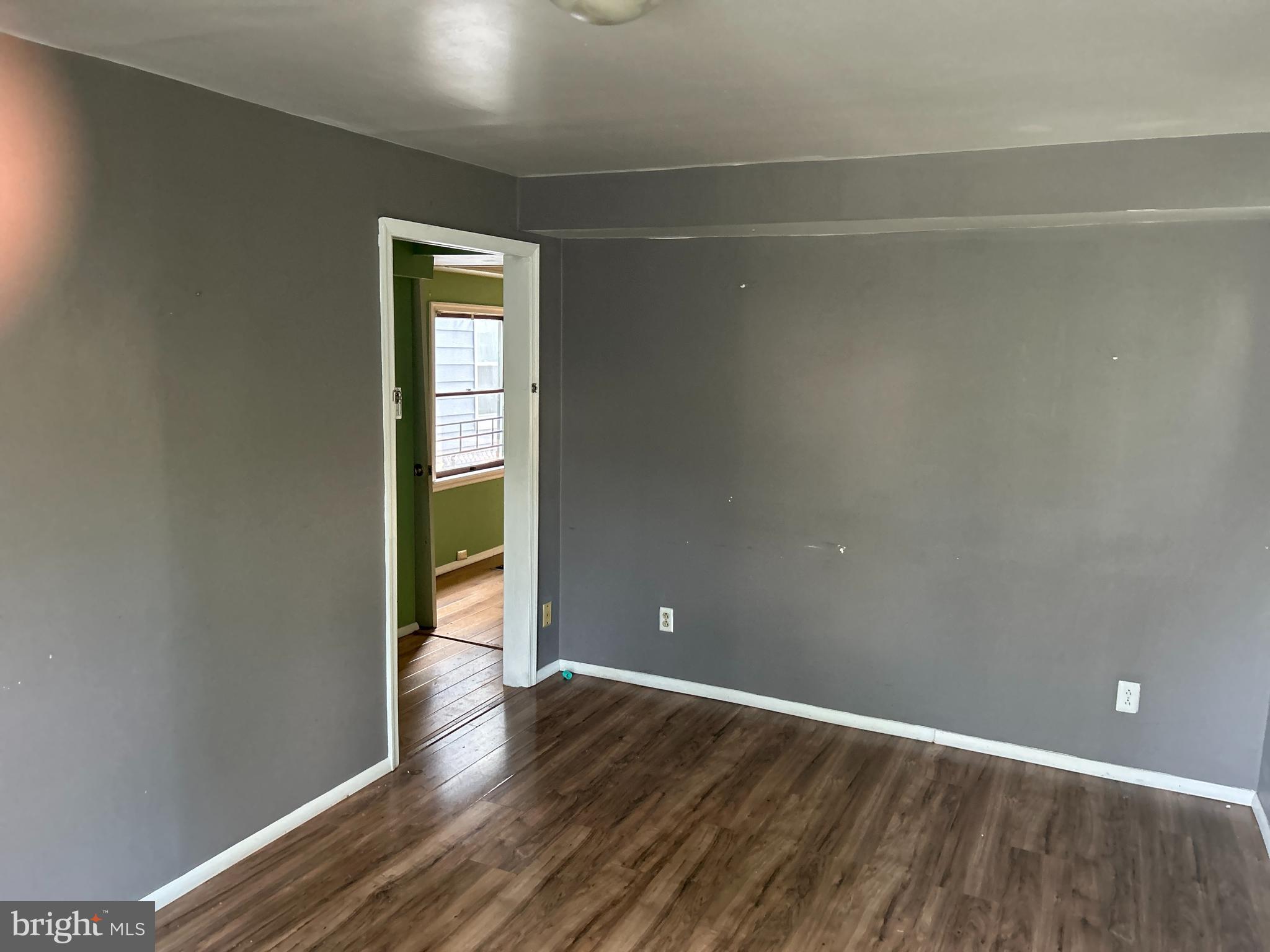 46 Penn Street Penns Grove, NJ 08069 - Photo 6 of 18 a view of empty room with wooden floor