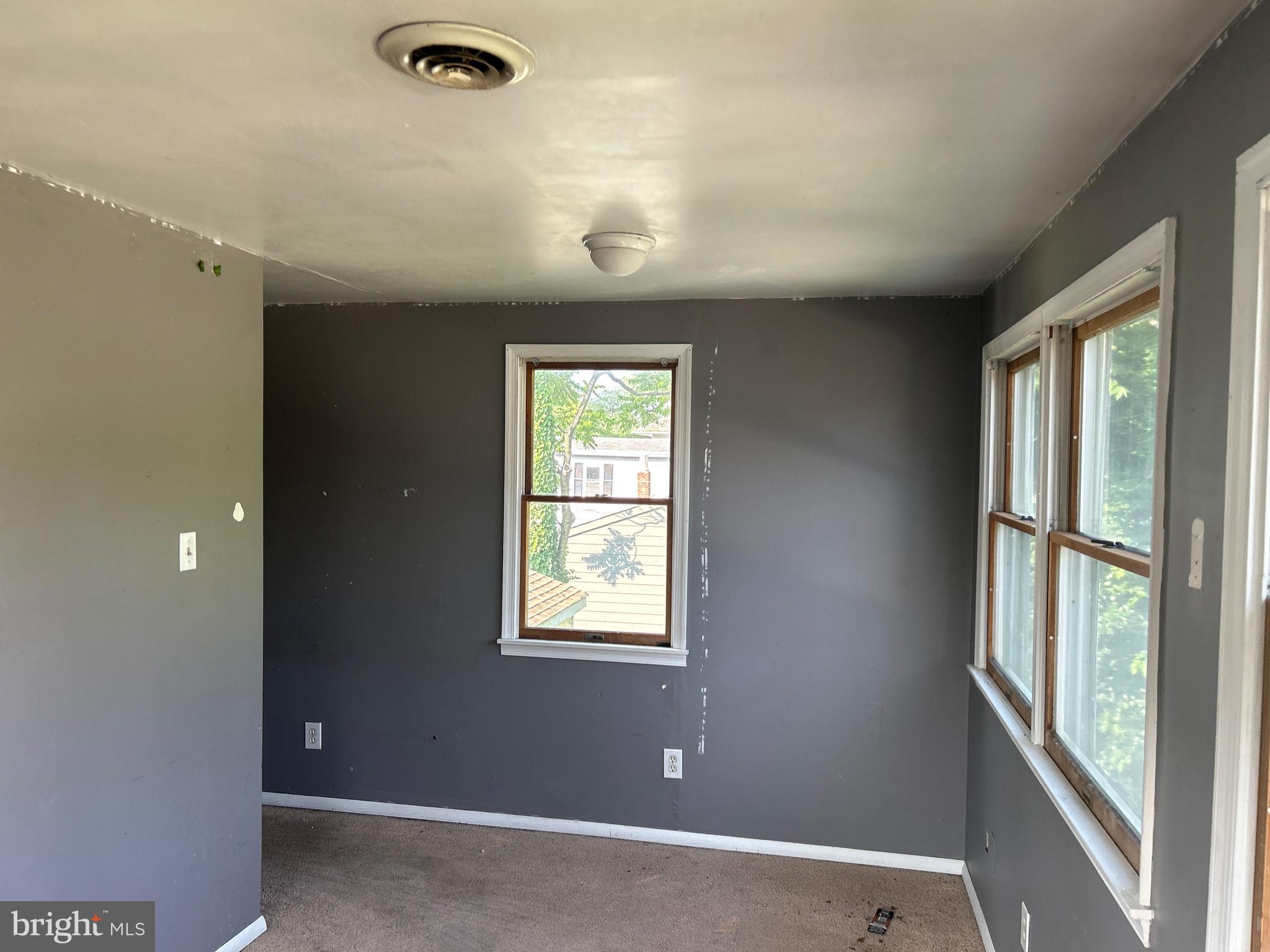 46 Penn Street Penns Grove, NJ 08069 - Photo 7 of 18 an empty room with windows and closet