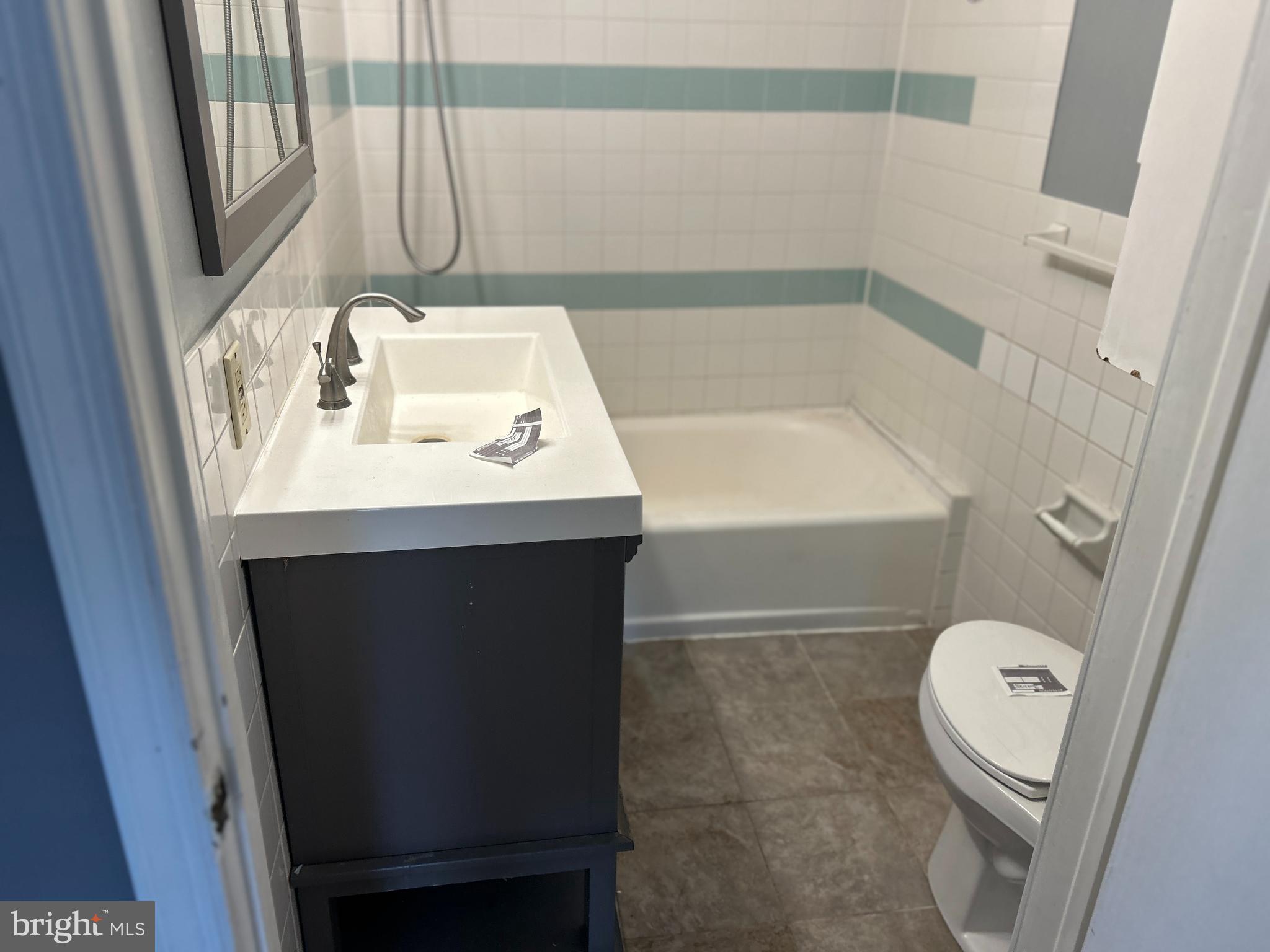 46 Penn Street Penns Grove, NJ 08069 - Photo 8 of 18 a bathroom with a sink toilet and tub