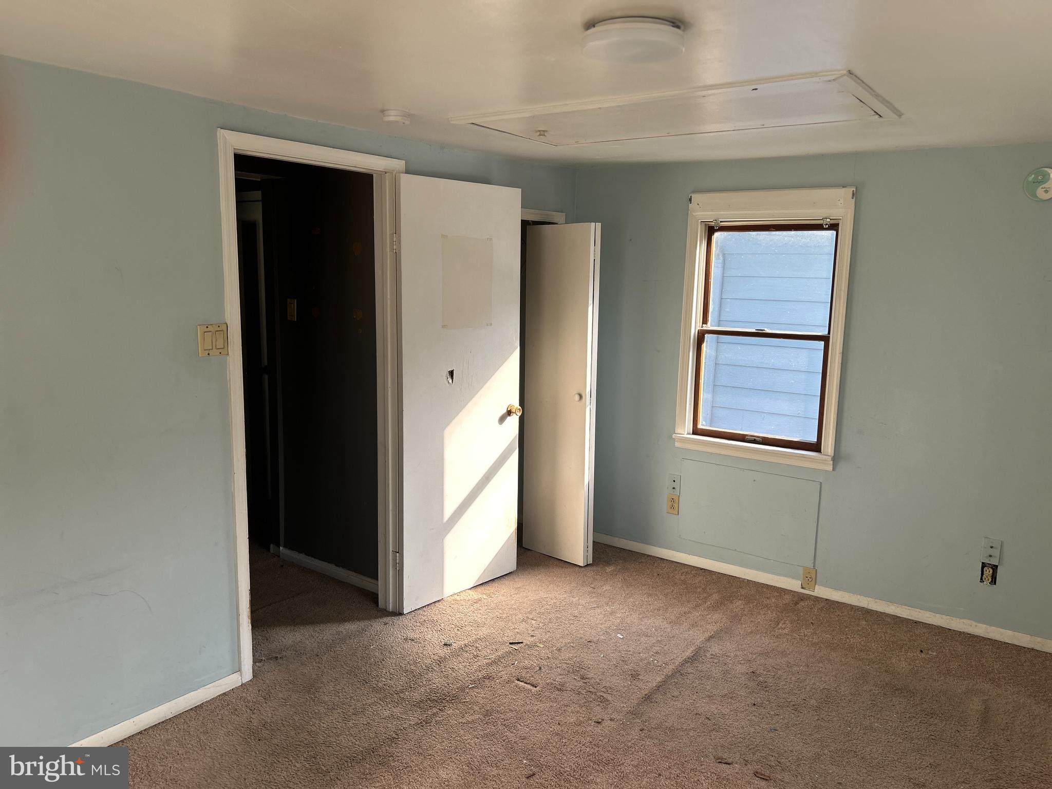 46 Penn Street Penns Grove, NJ 08069 - Photo 9 of 18 an empty room with windows and closet