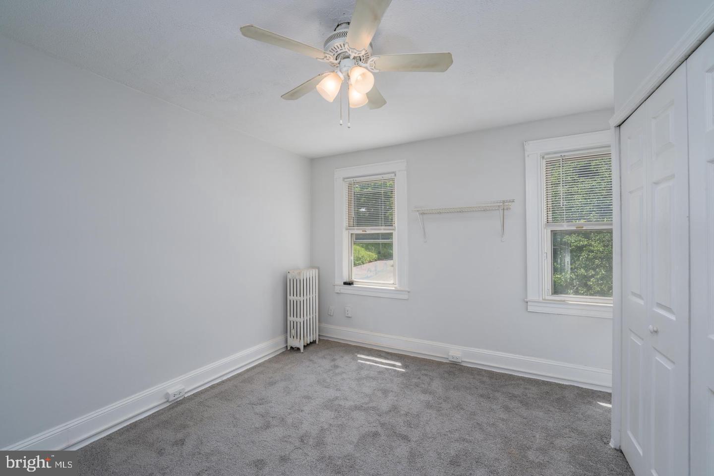 1637 Spence Street Baltimore, MD 21230 - Photo 11 of 22 an empty room with a window and a fan