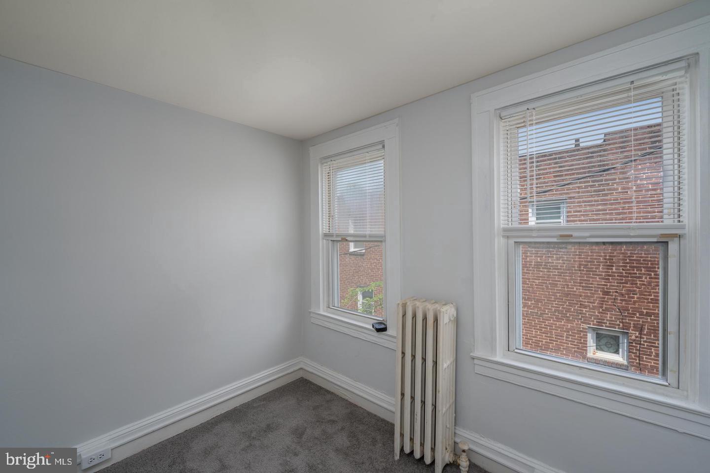 1637 Spence Street Baltimore, MD 21230 - Photo 17 of 22 a view of an empty room with a window