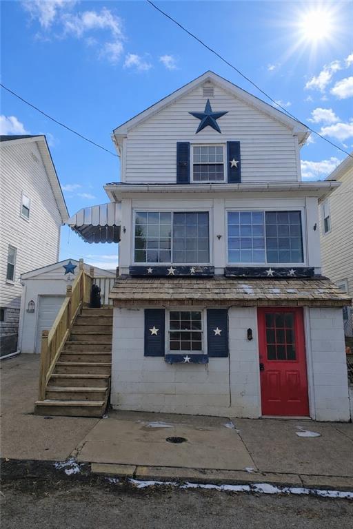 a front view of a house with a garage
