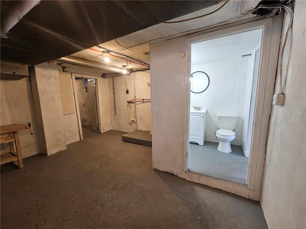 539 Walnut Street Vandergrift, PA 15690 - Photo 27 of 33 a view of a room with wooden floor and a bathroom