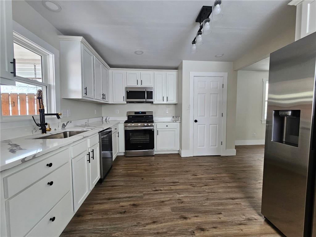 539 Walnut Street Vandergrift, PA 15690 - Photo 5 of 33 a kitchen with stainless steel appliances granite countertop a sink stove and refrigerator