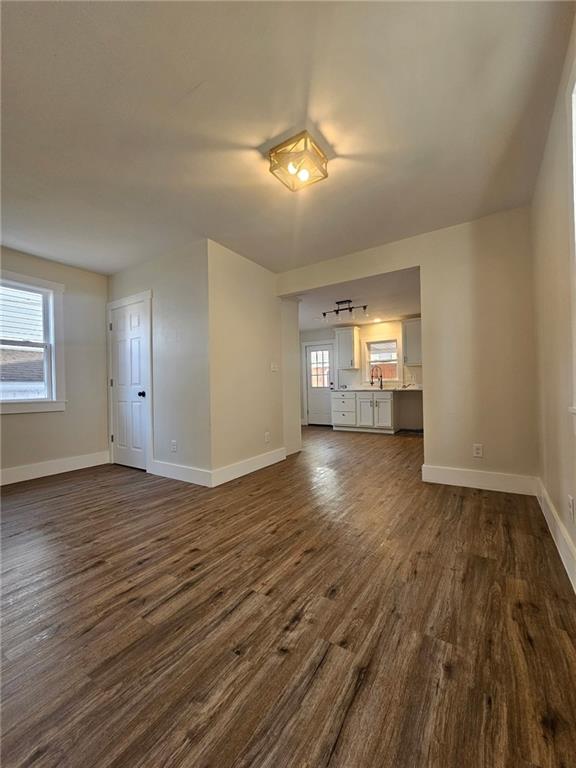 539 Walnut Street Vandergrift, PA 15690 - Photo 9 of 33 a view of empty room with wooden floor and fan