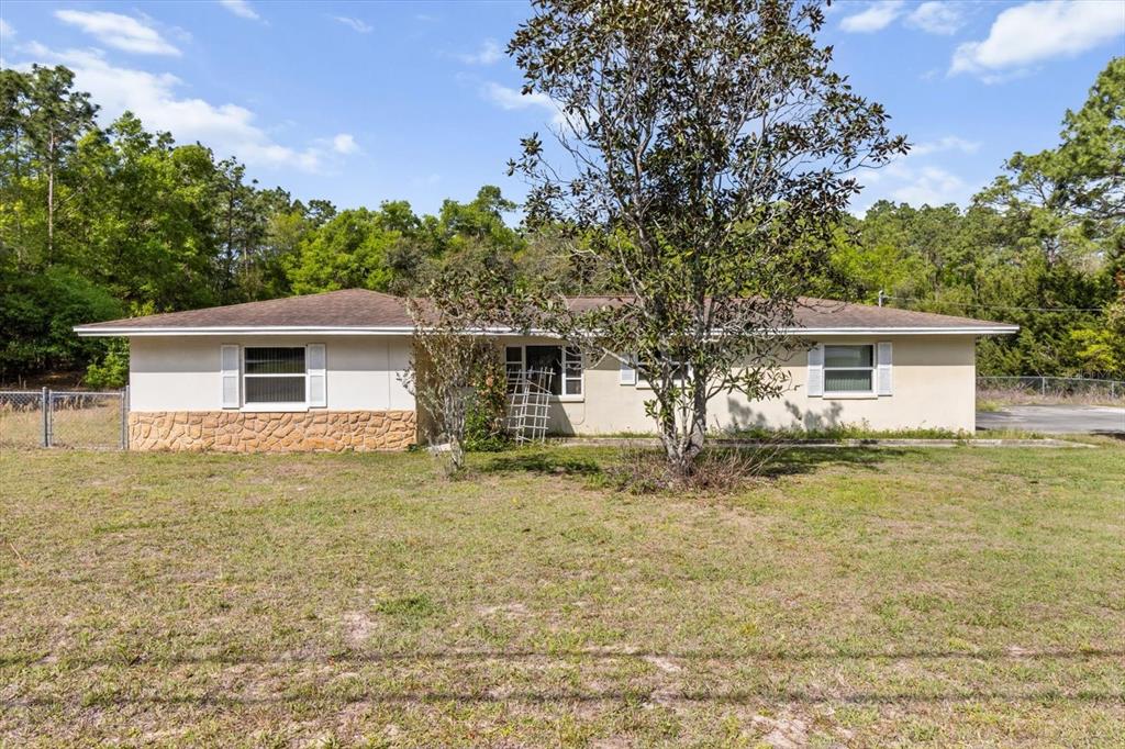 5580 South Ashley Terrace Inverness, FL 34452 - Photo 1 of 1 a front view of house with yard and trees