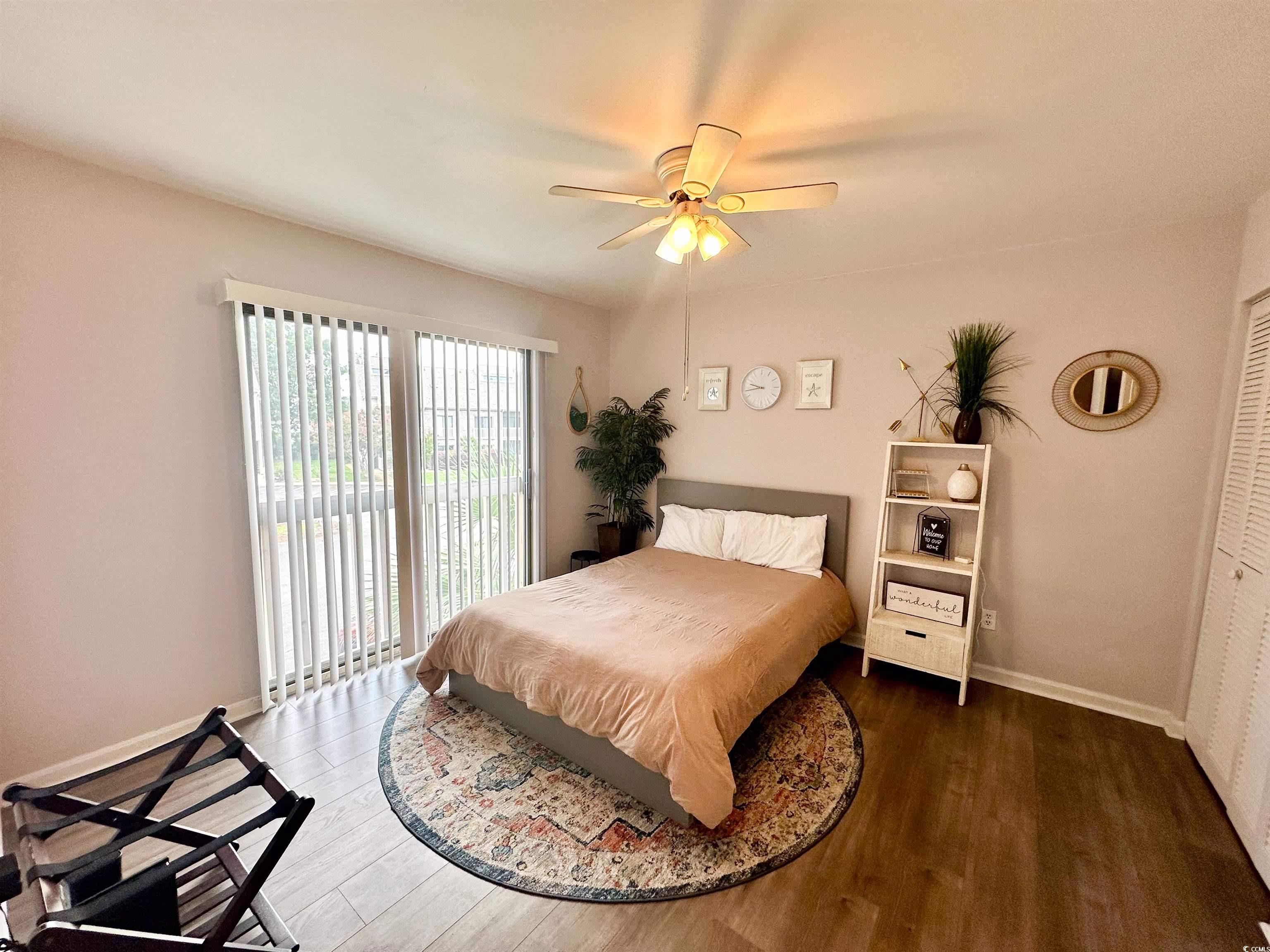 1356 Glenns Bay Road, Unit C202 Surfside Beach, SC 29575 - Photo 16 of 35 Bathroom featuring vanity, wood finished floors, and a shower with curtain