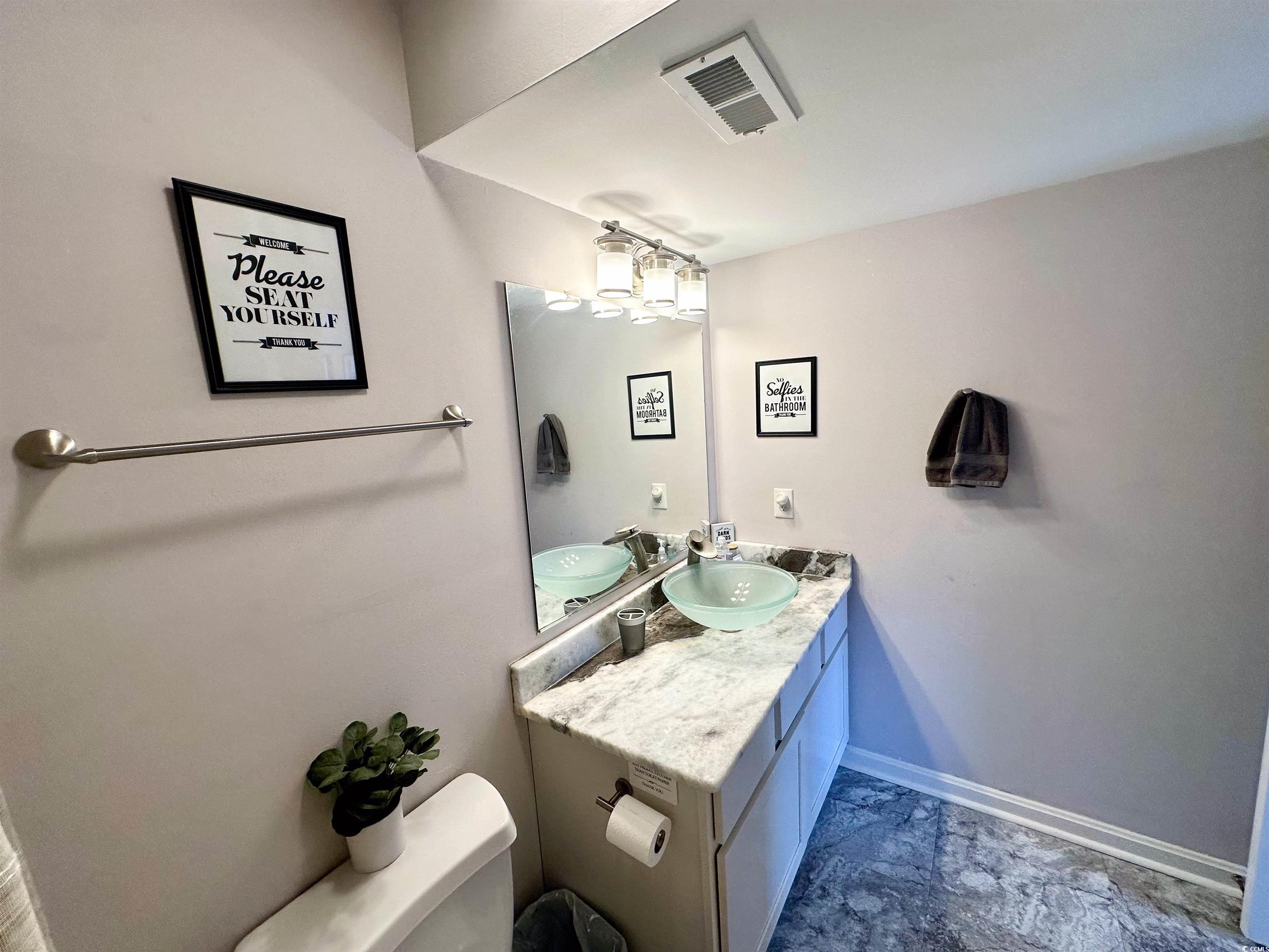 1356 Glenns Bay Road, Unit C202 Surfside Beach, SC 29575 - Photo 18 of 35 Bedroom featuring wood finished floors and ceiling fan