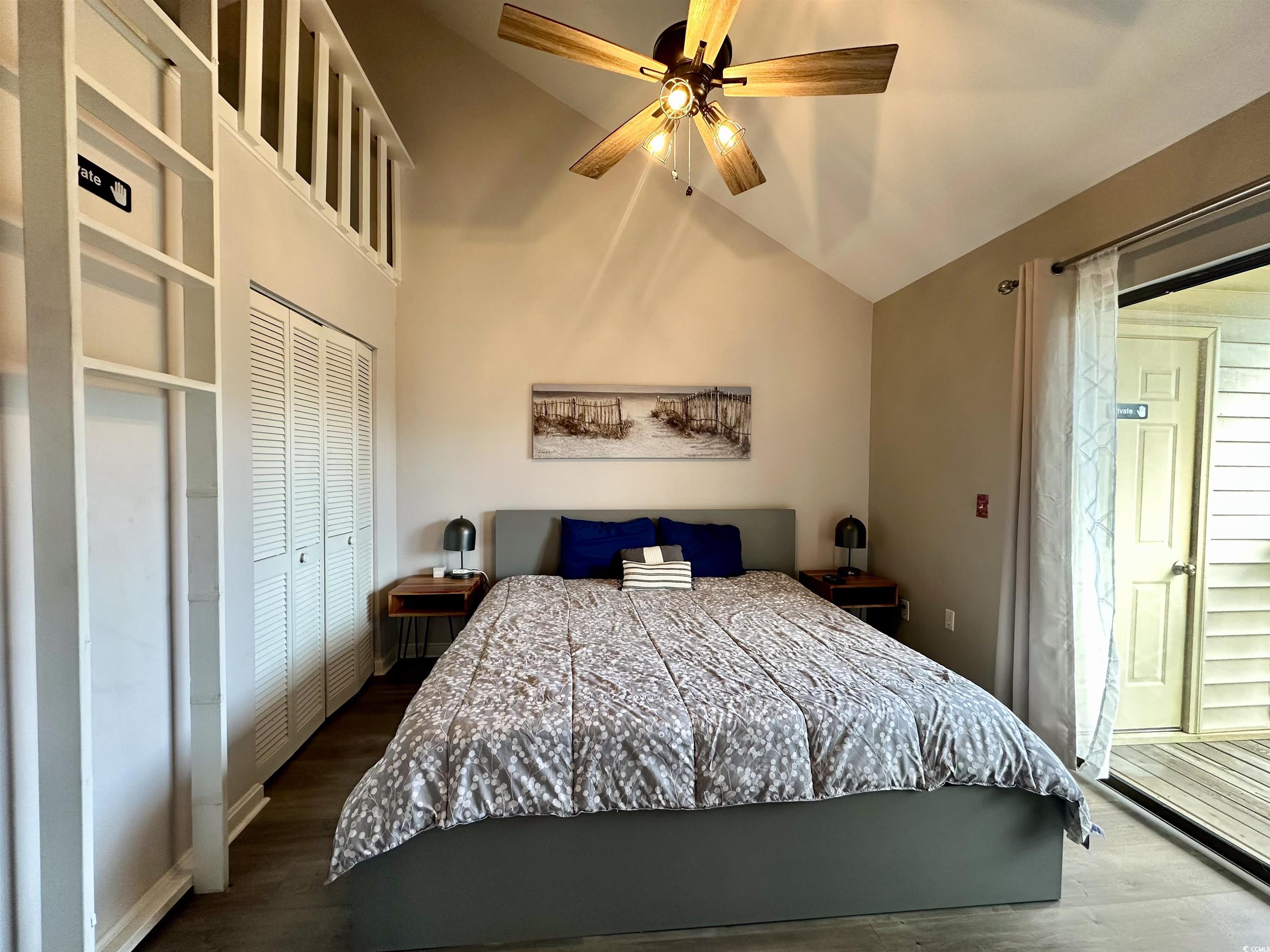 1356 Glenns Bay Road, Unit C202 Surfside Beach, SC 29575 - Photo 24 of 35 Living room featuring high vaulted ceiling, dark wood-type flooring, and a ceiling fan