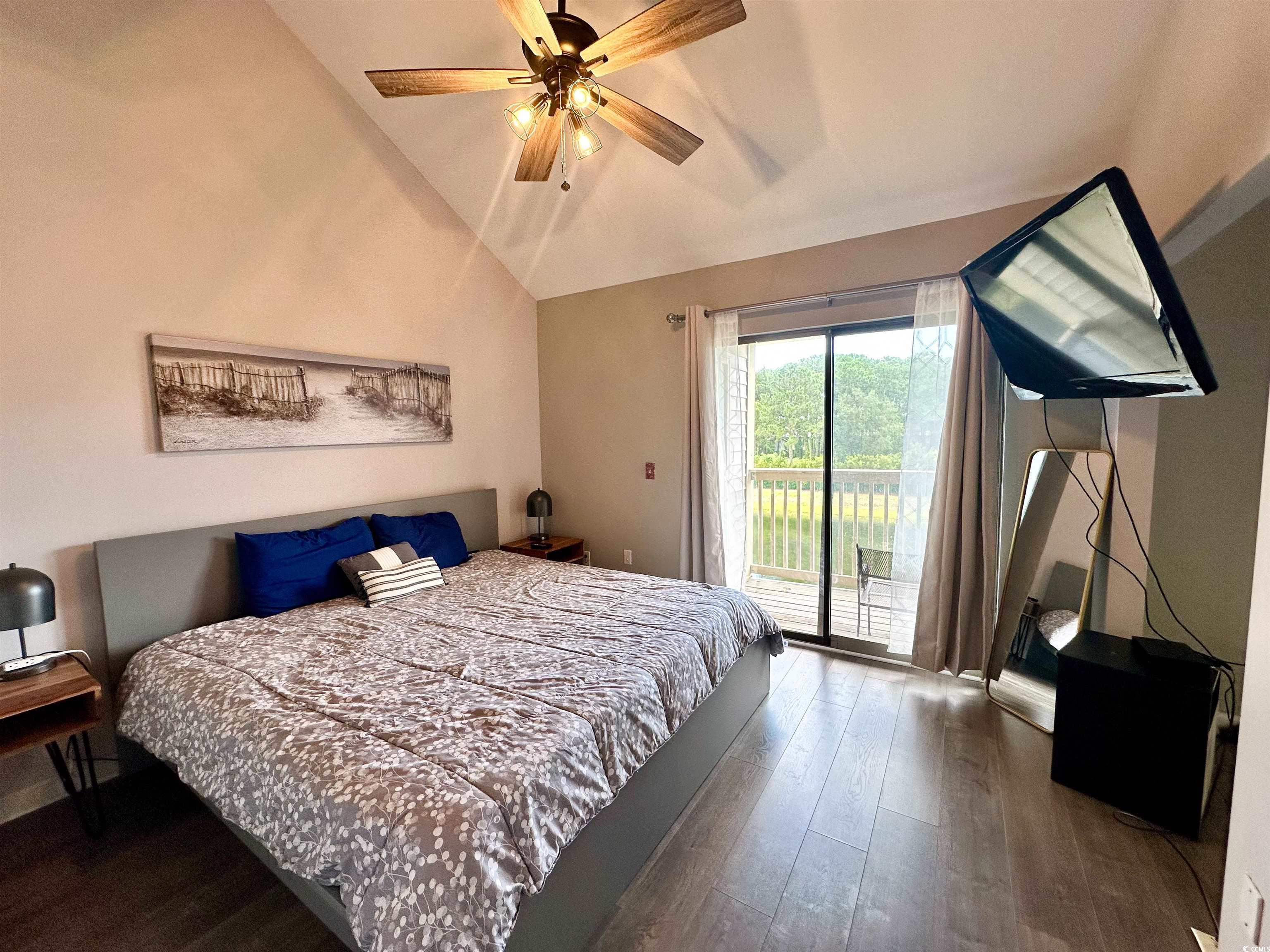 1356 Glenns Bay Road, Unit C202 Surfside Beach, SC 29575 - Photo 26 of 35 Bedroom with a closet, dark wood-style floors, high vaulted ceiling, and ceiling fan