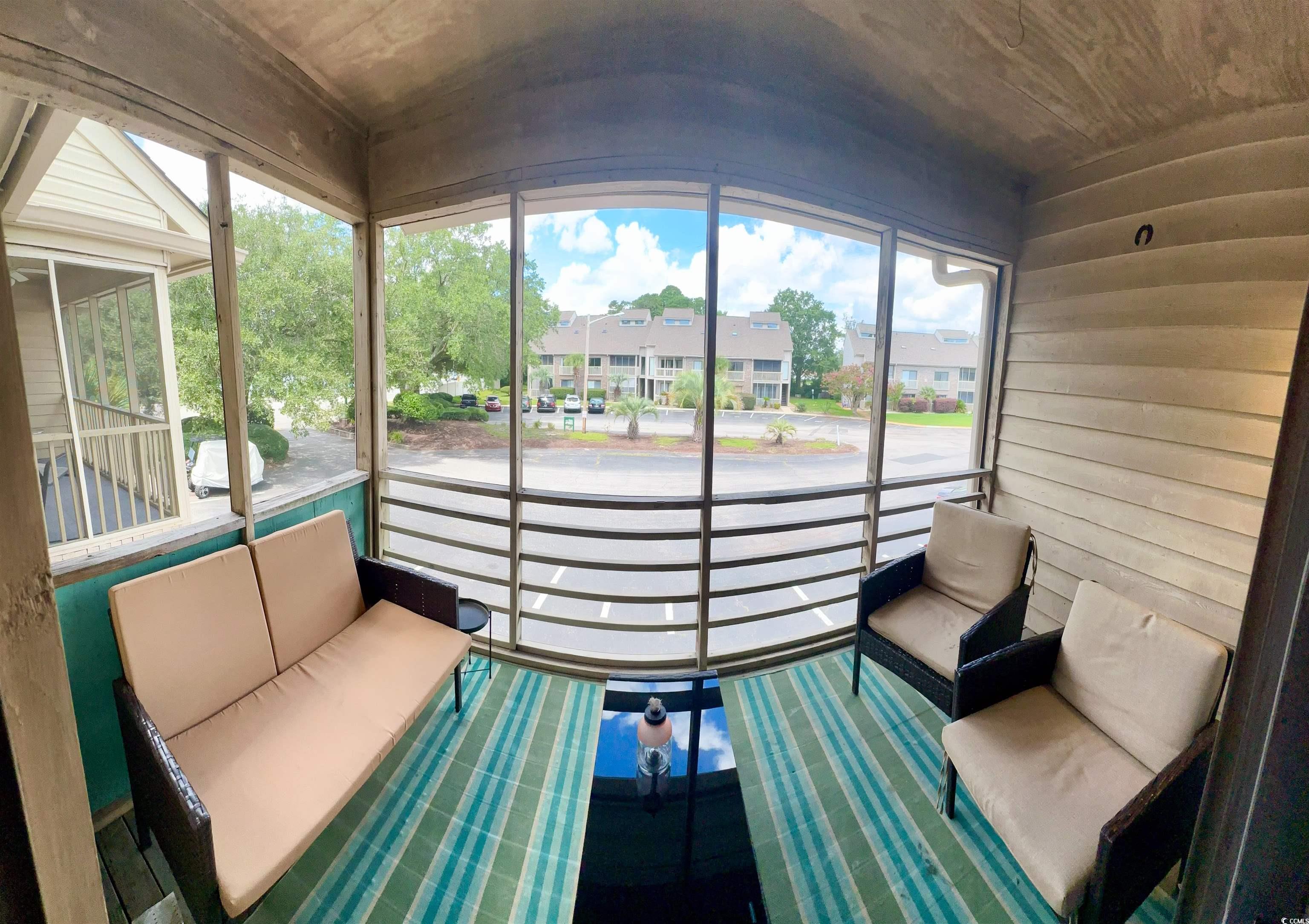 1356 Glenns Bay Road, Unit C202 Surfside Beach, SC 29575 - Photo 30 of 35 Unfurnished sunroom with plenty of natural light