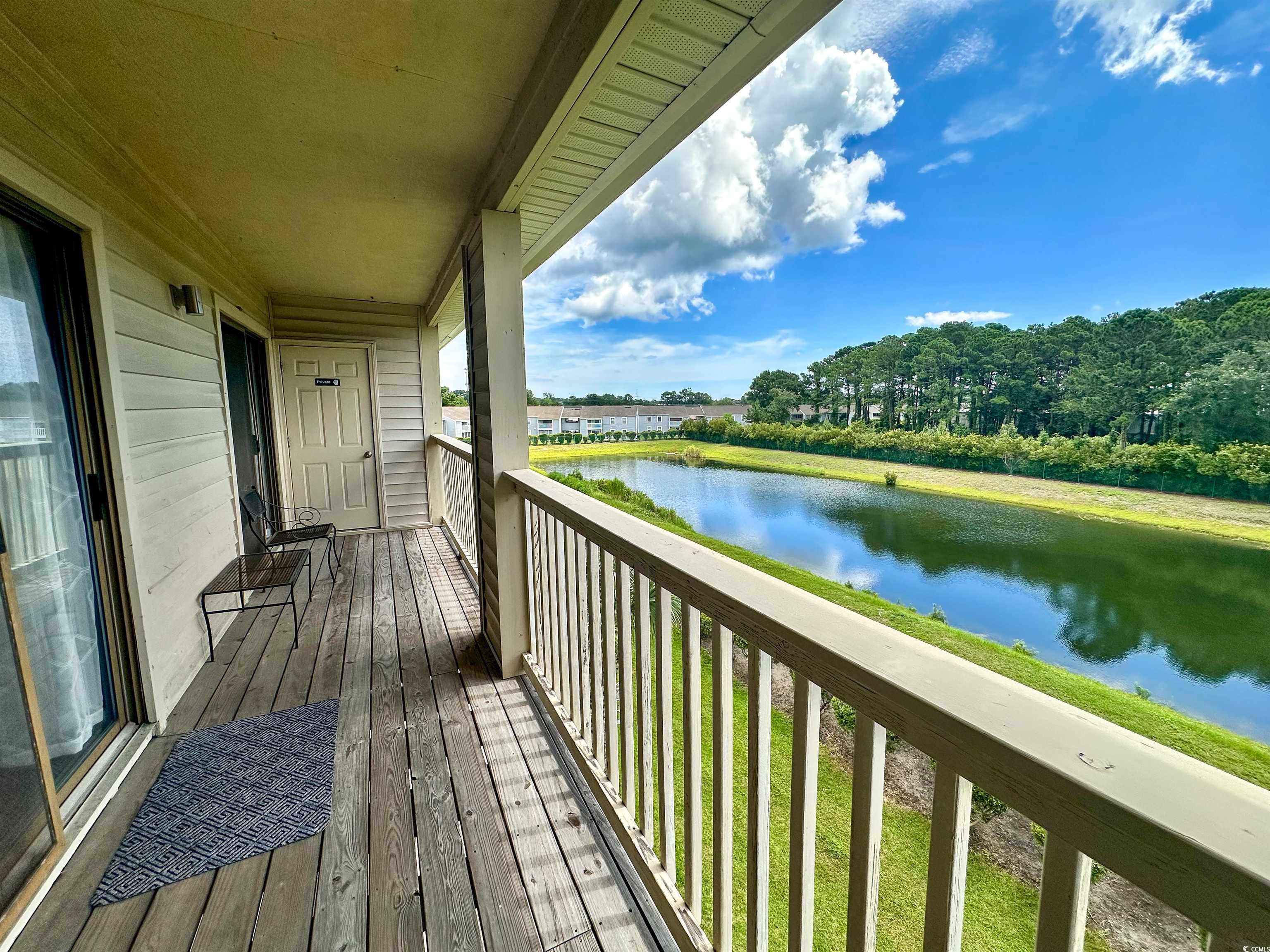 1356 Glenns Bay Road, Unit C202 Surfside Beach, SC 29575 - Photo 32 of 35 Wooden terrace with a water view