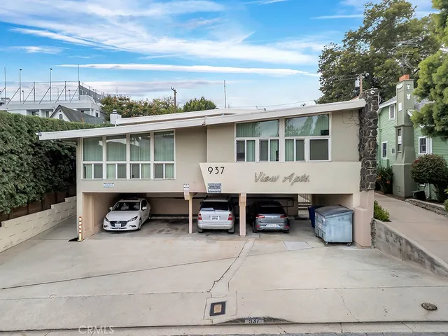 a view of a car and front view of a house