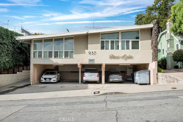 a view of a car park in front of house